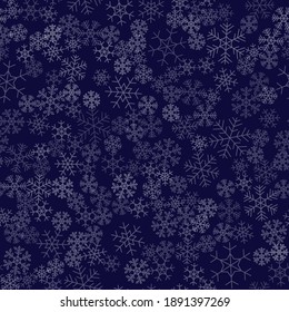 Seamless winter background consisting of snowflakes of different shapes