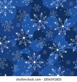 Seamless winter background with gentle snowflakes on a zabasny background in mugs in blue. hand drawn doodle style.