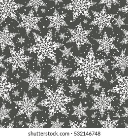 Seamless winter background of openwork snowflakes. Pattern.