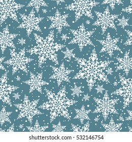Seamless winter background of openwork snowflakes. Pattern.