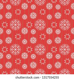 Seamless winter holiday pattern with snowflakes on red background.