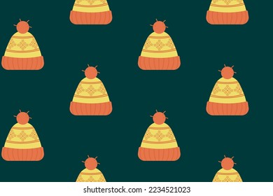 Sombrero de punto de invierno sin foco sobre el patrón de navidad de fondo verde oscuro