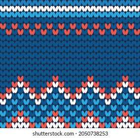 Patrón de punto de invierno sin foco en tonos azules con acentos rojos y blancos.