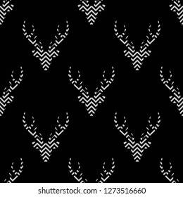 seamless winter mosaic pattern with deer head with antlers. simple striped geometry design style.  vector flat Christmas black and white ornament on white background