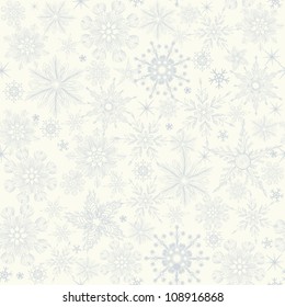 seamless winter pattern with blue snowflakes on white background