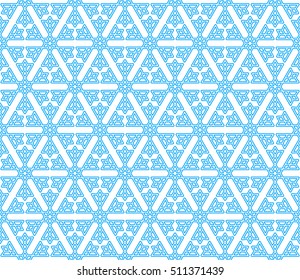 Seamless winter pattern of blue snowflakes isolated on white background. Vector illustration for New Year and Christmas design.
