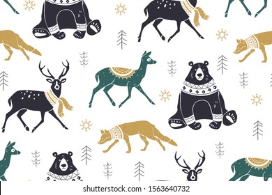 Seamless winter pattern with forest animals reindeer, fox, bear. Scandinavian style. Silhouettes of wild animals in scarves with ornaments. Christmas background.