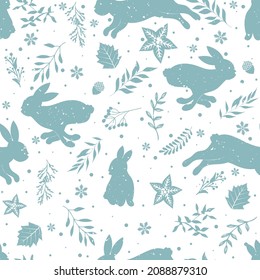 Seamless winter pattern with hares and leaves.