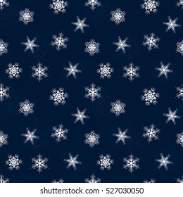 seamless winter pattern of Lacy snowflakes on blue background