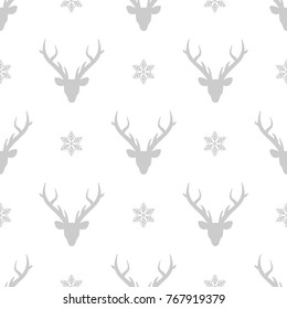 seamless winter pattern with  silver grey snowflakes and deer heads with antlers. vector flat Christmas ornament on white background. winter reindeer texture.