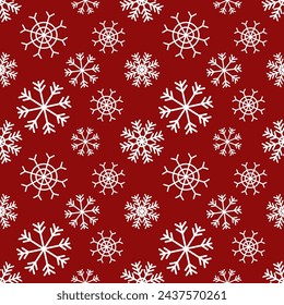 Seamless winter pattern with snowflakes. On a red background