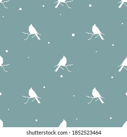 seamless winter pattern with  snowflakes and red birds cardinals. vector flat Christmas ornament on blue background. winter birdy cute texture. Holiday wallpaper