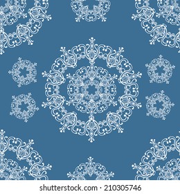 Seamless winter pattern with snowflakes.Christmas background. Paper for packing Christmas gifts.