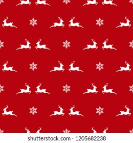seamless winter pattern with white snowflakes and deers with antlers. vector flat Christmas ornament on red background. winter reindeer texture.