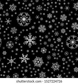 Seamless winter pattern with white snowflakes on black background. Snow vector illustration design for Christmas and New Year print textile paper