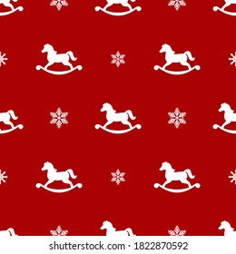 seamless winter pattern with white  snowflakes and horse toys. vector flat Christmas ornament on red background. winter holiday texture.