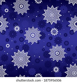 Seamless winter pattern with white snowflakes on blue background.