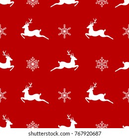 seamless winter pattern with white snowflakes and deers with antlers. vector flat Christmas ornament on red background. winter reindeer texture.