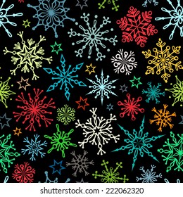 Seamless winter texture. Colourful snowflakes. Christmas template.