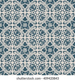 Seamless worn out antique background image of spiral leaf kaleidoscope