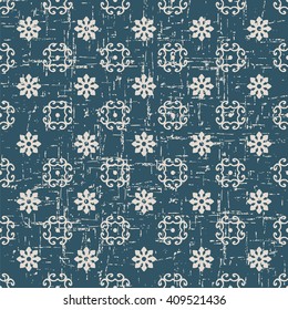 Seamless worn out antique background image of spiral cross flower