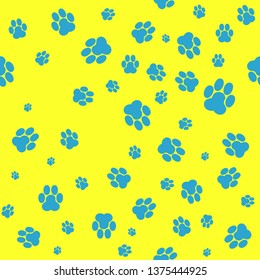 Seamless yellow background on blue footprint paw pattern vector