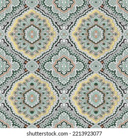 seamless yellow paisley pattern on green background