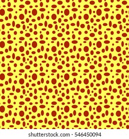 Seamless yellow pattern with brown polka dots in different sizes as a background - Eps10 vector graphics and illustration