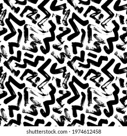 Seamless zig zag vector pattern. Abstract monochrome geometric brush strokes. Black and white hand painted ink illustration. Freehand zigzag brush strokes. Simple monochrome geometric ornament