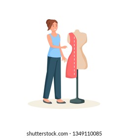 Seamstress standing with needle near mannequin dressed pattern isolated on white background