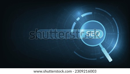 Search engine optimization (SEO) concept on dark blue background. Internet technology for business companies. Large magnifying glass for monitoring and analyzing data.