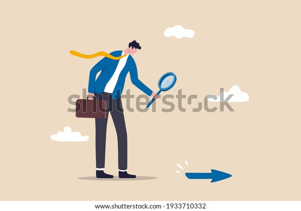 Searching for business direction, strategy or\
discover business opportunity or solution for work difficulty\
concept, businessman leader using magnifying glass to discover\
arrow on the floor.