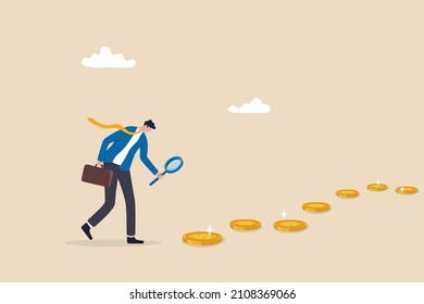 Searching for investment opportunity, financial success or salary raise, inspect way to make profit and earning concept, curios businessman with magnifier inspect and follow money coins trail.