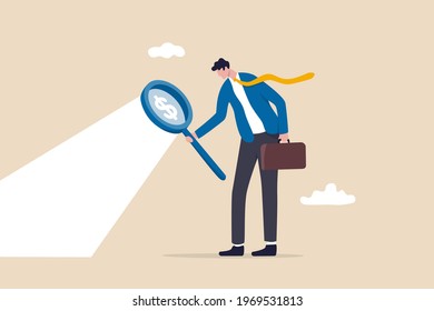 Searching for investment opportunity, stock market research or hidden cost and expense concept, businessman looking through magnifying glass to see dollar money sign search for money.