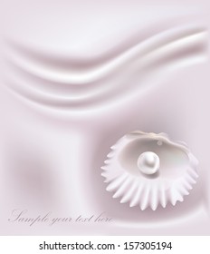 Seashell and pearl on silk