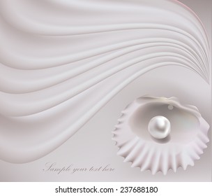Seashell with pearls on silk