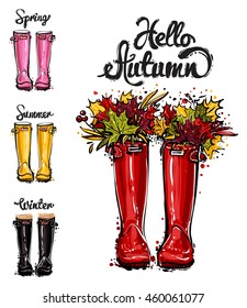 Season greeting card. Hand drawn illustration of fashion red, yellow, pink, black rubber boots, bouquet of autumn leaves and spring, summer, winter, hello autumn lettering. Isolated elements on white