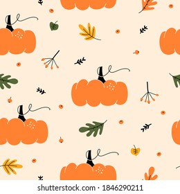 Seasonal autumn seamless pattern with with pumpkins, berries and leaves. Autumnal hand drawn decorative elements.