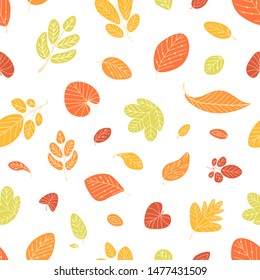 Seasonal seamless pattern with fallen autumn leaves on white background. Decorative backdrop with dried foliage. Flat cartoon colorful vector illustration for wrapping paper, textile print, wallpaper.