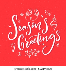 Season's greeting text with hand drawn Christmas elements. Greeting card design with vintage typography