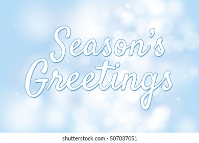 Season's greetings with blue bokeh background for christmas theme