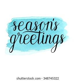 Seasons greetings card, poster. Vector winter holidays background with hand lettering. Hand drawn blue watercolor paint brush spot. 