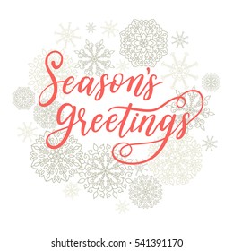 Season's Greetings card. Vector winter holiday background with hand lettering calligraphy, snowflakes, falling snow.