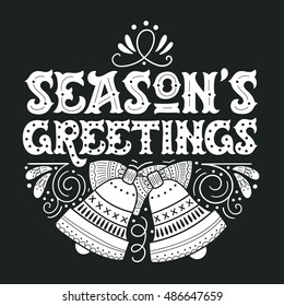 Seasons greetings. Hand drawn winter holiday image. Lettering with ornate Christmas bells and decorative design elements. This illustration can be used as a greeting card, poster or print.