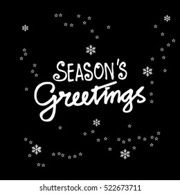 Seasons greetings. Hand lettering calligraphic inscription by brush. 