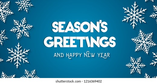 Season's Greetings   Happy New Year greeting card concept and white snowflakes   blue background