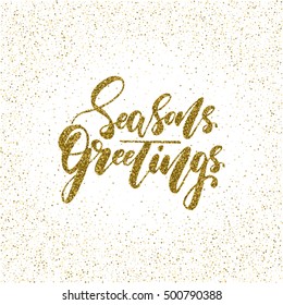 Seasons greetings - ink freehand lettering with golden texture. Modern brush calligraphy, isolated on the golden star shape confetti background.