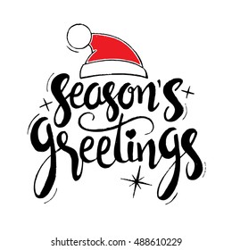 Season's greetings lettering. Modern vector hand drawn calligraphy with Santa Claus red hat and stars isolated on white background for your greeting card design