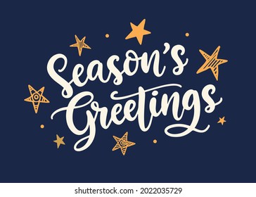 Season's Greetings lettering text banner. Christmas greeting card with modern calligraphy and stars. Vector illustration, white and golden on blue background