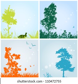 seasons theme with silhouettes of trees and grass